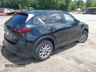 2023 Mazda CX-5 S Carbon Edition z VIN JM3KFBCMXP0201665, wystawiony jako IAAI lot #39965378 z przebiegiem 29 105 mil mil oraz . Historia ofert i sprzedaży dostępna na DreamBid. Obrazek 4.