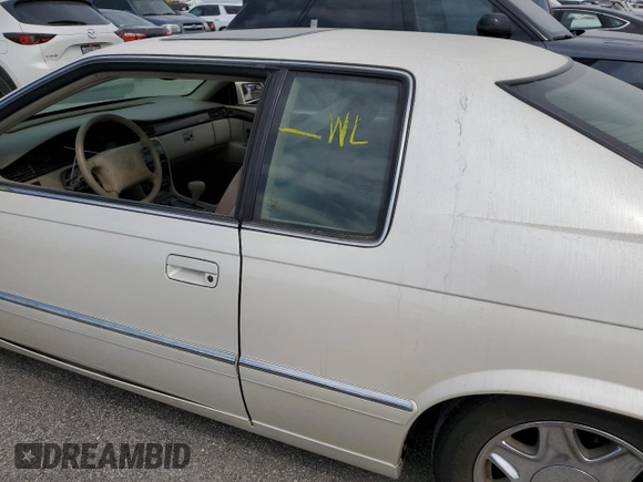 1999 Cadillac Eldorado z VIN 1G6EL12Y7XU615169, wystawiony jako Copart lot #76459744 z przebiegiem Nie podano mil oraz Szkoda całkowita • Salvage title. Historia ofert i sprzedaży dostępna na DreamBid. Obrazek 12.