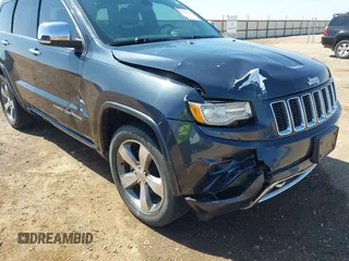 2015 Jeep Grand Cherokee Overland with VIN 1C4RJECG3FC635327, listed as a IAAI auction lot 41910559 with 118,519 mi miles and . Bid and sale history available at DreamBid. Image 6.
