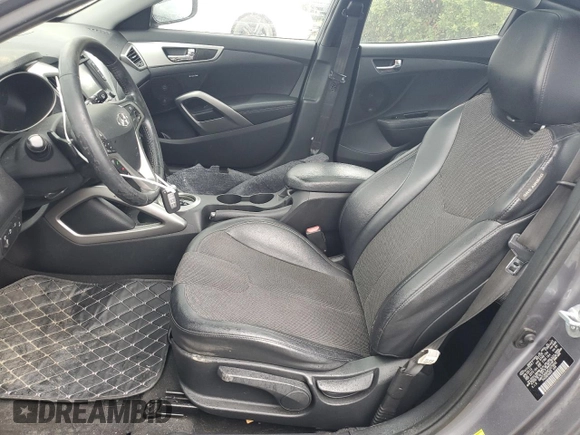 2012 Hyundai Veloster w/Gray Int z VIN KMHTC6AD9CU079542, wystawiony jako Copart lot #55998045 z przebiegiem 98 065 mil mil oraz Szkoda całkowita • Salvage title. Historia ofert i sprzedaży dostępna na DreamBid. Obrazek 7.