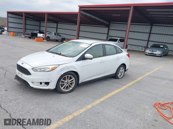 2015 Ford Focus SE with VIN 1FADP3F23FL255584, listed as a IAAI auction lot 41990636 with 151,389 mi miles. Bid and sale history available at carsss.com. Image 2.