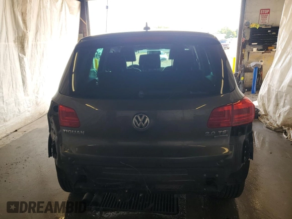 2014 Volkswagen Tiguan SEL with VIN WVGBV3AX2EW541476, listed as a Copart auction lot 64817795 with 158,032 mi miles and Salvage title. Bid and sale history available at DreamBid. Image 6.