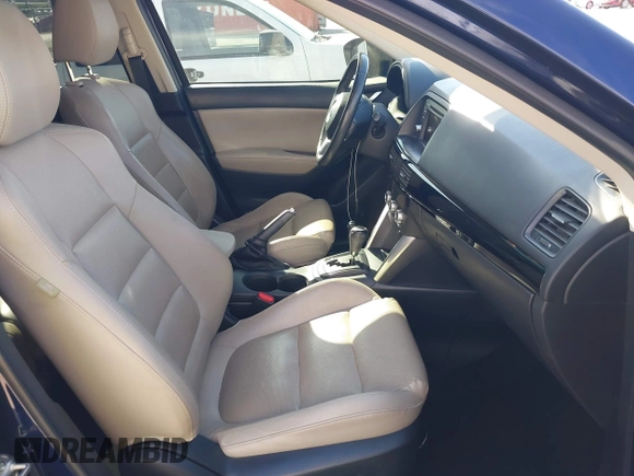 2014 Mazda CX-5 Grand Touring with VIN JM3KE2DY7E0376389, listed as a IAAI auction lot 42014946 with 126,081 mi miles. Bid and sale history available at carsss.com. Image 5.
