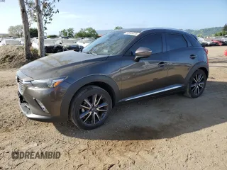 2018 Mazda CX-3 Grand Touring z VIN JM1DKFD74J0305198, wystawiony jako Copart lot #53392075 z przebiegiem 57 590 mil mil oraz Szkody całkowita. Historia ofert i sprzedaży dostępna na DreamBid. Obrazek 1.