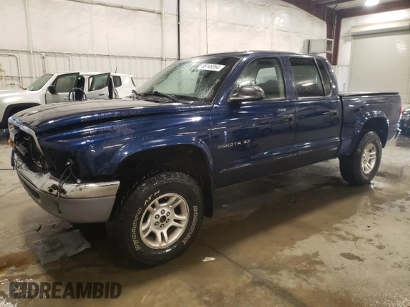 2002 Dodge Dakota SLT with VIN 1B7HG48N12S653207, listed as a Copart auction lot 86149264 with 215,021 mi miles and Salvage Title. Bid and sale history available at carsss.com. Image 1.