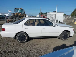 1995 Toyota Camry LE z VIN JT2SK12E5S0332027, wystawiony jako IAAI lot #42078977 z przebiegiem 128 929 mil mil oraz . Historia ofert i sprzedaży dostępna na DreamBid. Obrazek 14.