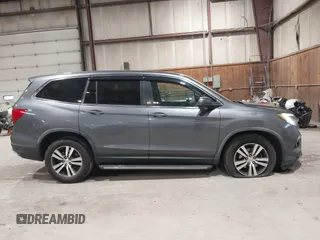 2016 Honda Pilot EX-L with VIN 5FNYF6H5XGB010230, listed as a IAAI auction lot 41858811 with 194,119 mi miles. Bid and sale history available at carsss.com. Image 13.