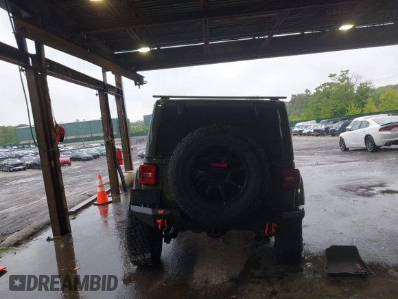 2021 Jeep Wrangler Unlimited Rubicon with VIN 1C4HJXFG4MW543254, listed as a IAAI auction lot 42316180 with 50,696 mi miles and . Bid and sale history available at DreamBid. Image 16.