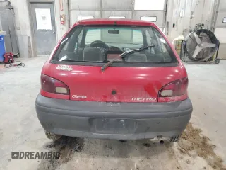 1996 Geo Metro z VIN 2C1MR2293T6729620, wystawiony jako Copart lot #85934594 z przebiegiem 224 971 mil mil oraz Szkody całkowita. Historia ofert i sprzedaży dostępna na DreamBid. Obrazek 6.