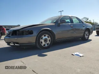 2003 Cadillac Seville Luxury SLS z VIN 1G6KS54Y93U279660, wystawiony jako Copart lot #75961404 z przebiegiem 107 591 mil mil oraz Szkoda całkowita • Salvage title. Historia ofert i sprzedaży dostępna na DreamBid. Obrazek 1.