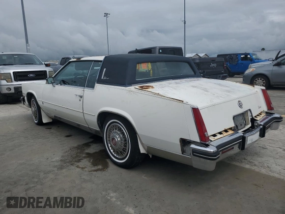 1984 Cadillac Eldorado z VIN 1G6AL5783EE654296, wystawiony jako Copart lot #74945374 z przebiegiem 37 040 mil mil oraz Szkoda całkowita • Salvage title. Historia ofert i sprzedaży dostępna na DreamBid. Obrazek 2.