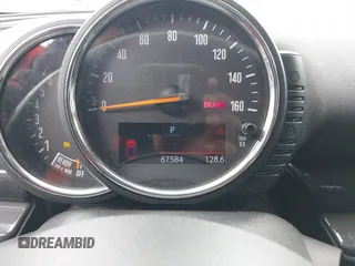 2016 MINI Clubman z VIN WMWLN5C56G2E30309, wystawiony jako IAAI lot #41772501 z przebiegiem 67 584 mil mil oraz . Historia ofert i sprzedaży dostępna na DreamBid. Obrazek 7.