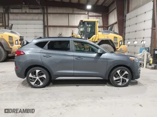 2018 Hyundai Tucson Value with VIN KM8J3CA22JU688957, listed as a IAAI auction lot 41868195 with 117,256 mi miles. Bid and sale history available at carsss.com. Image 13.