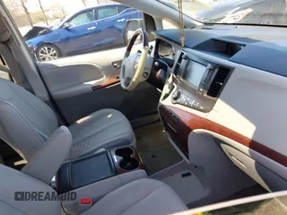 2013 Toyota Sienna XLE with VIN 5TDDK3DC0DS059036, listed as a IAAI auction lot 42069896 with 124,105 mi miles and . Bid and sale history available at DreamBid. Image 5.