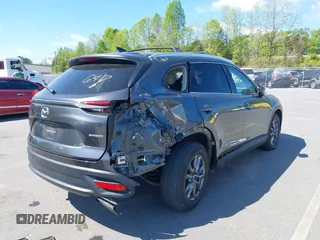 2021 Mazda CX-9 Touring with VIN JM3TCACY7M0503484, listed as a IAAI auction lot 42013262 with 63,777 mi miles and . Bid and sale history available at DreamBid. Image 4.