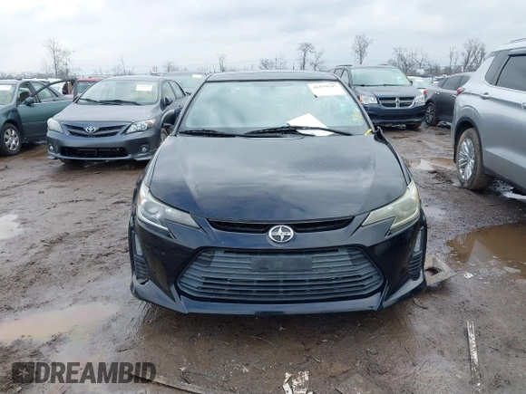 2014 Scion tC with VIN JTKJF5C74E3069104, listed as a IAAI auction lot 41579797 with 130,668 mi miles. Bid and sale history available at carsss.com. Image 12.