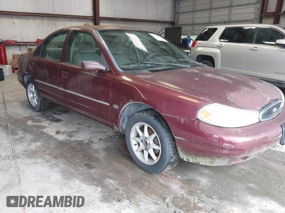 1999 Ford Contour SE z VIN 1FAFP6639XK144984, wystawiony jako IAAI lot #42363538 z przebiegiem 160 891 mil mil oraz . Historia ofert i sprzedaży dostępna na DreamBid. Obrazek 1.