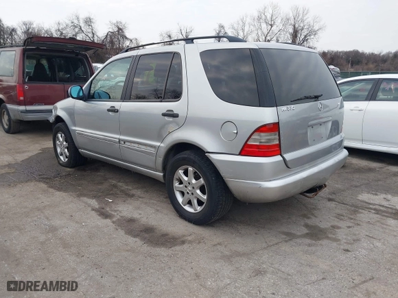 1999 Mercedes-Benz M-Class with VIN 4JGAB72E4XA113675, listed as a IAAI auction lot 41554604 with 230,092 mi miles. Bid and sale history available at carsss.com. Image 3.
