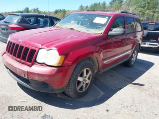 2009 Jeep Grand Cherokee Laredo with VIN 1J8GR48K79C543304, listed as a IAAI auction lot 42151011 with 157,679 mi miles. Bid and sale history available at carsss.com. Image 2.