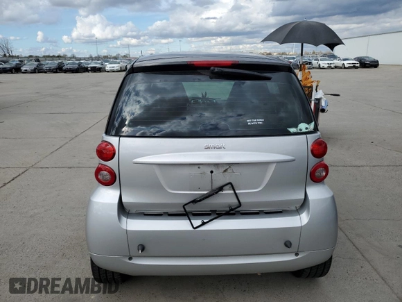 2012 Smart fortwo Pure z VIN WMEEJ3BA2CK549445, wystawiony jako Copart lot #48352495 z przebiegiem 53 406 mil mil oraz Tytuł czysty. Historia ofert i sprzedaży dostępna na DreamBid. Obrazek 6.