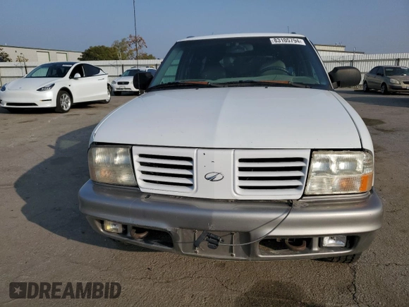 2000 Oldsmobile Bravada z VIN 1GHDT13W9Y2384823, wystawiony jako Copart lot #83105794 z przebiegiem Nie podano mil oraz Tytuł czysty. Historia ofert i sprzedaży dostępna na DreamBid. Obrazek 5.