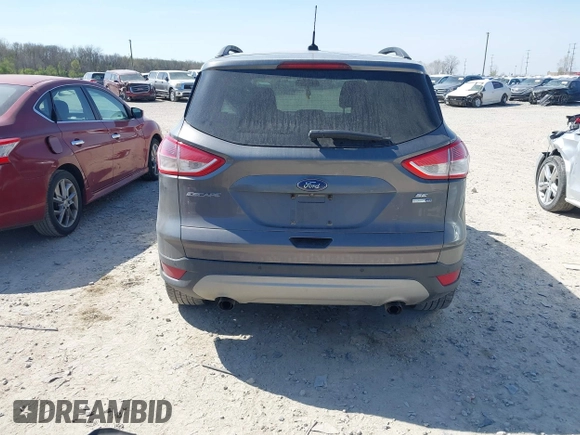2014 Ford Escape SE with VIN 1FMCU9GX0EUC75145, listed as a IAAI auction lot 42048519 with 186,670 mi miles and . Bid and sale history available at DreamBid. Image 16.