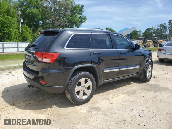 2013 Jeep Grand Cherokee Laredo with VIN 1C4RJEAG2DC519570, listed as a Copart auction lot 52066225 with 129,091 mi miles and Salvage Title. Bid and sale history available at carsss.com. Image 3.