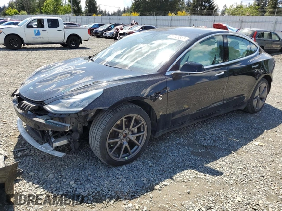 2020 Tesla Model 3 Long Range z VIN 5YJ3E1EBXLF795689, wystawiony jako Copart lot #56703555 z przebiegiem 62 556 mil mil oraz Szkoda całkowita • Salvage title. Historia ofert i sprzedaży dostępna na DreamBid. Obrazek 1.