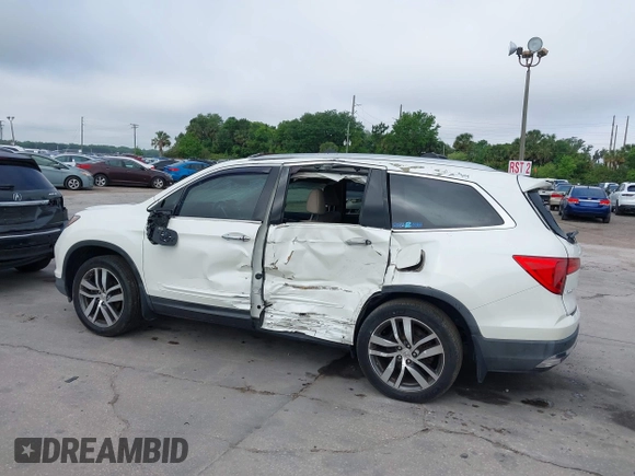 2016 Honda Pilot Elite with VIN 5FNYF6H00GB104329, listed as a IAAI auction lot 41905390 with 125,501 mi miles. Bid and sale history available at carsss.com. Image 14.