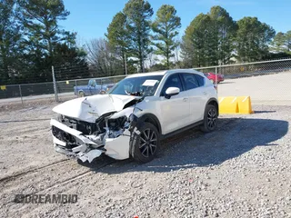 2018 Mazda CX-5 Grand Touring with VIN JM3KFADM0J0377026, listed as a IAAI auction lot 41649686 with 100,901 mi miles and . Bid and sale history available at DreamBid. Image 17.