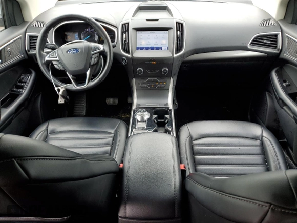 2020 Ford Edge SEL z VIN 2FMPK3J90LBB01559, wystawiony jako Copart lot #61365305 z przebiegiem 120 050 mil mil oraz Czysty tytuł • Clean title. Historia ofert i sprzedaży dostępna na DreamBid. Obrazek 8.