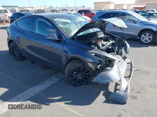 2023 Tesla Model Y Long Range z VIN 7SAYGAEE4PF945847, wystawiony jako IAAI lot #41071924 z przebiegiem 33 454 mil mil oraz . Historia ofert i sprzedaży dostępna na DreamBid. Obrazek 1.