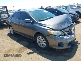 2011 Toyota Corolla L with VIN 2T1BU4EE7BC738640, listed as a IAAI auction lot 42024474 with 164,322 mi miles. Bid and sale history available at carsss.com. Image 1.
