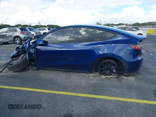 2021 Tesla Model Y Standard Range with VIN 5YJYGDED4MF112857, listed as a IAAI auction lot 41134600 with Not Provided miles and . Bid and sale history available at DreamBid. Image 13.