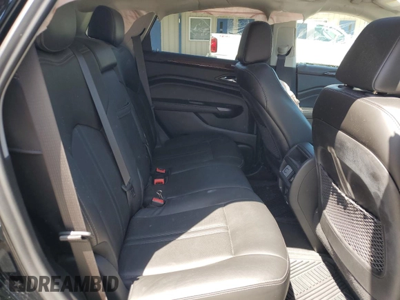 2014 Cadillac SRX Luxury Collection z VIN 3GYFNEE32ES647165, wystawiony jako Copart lot #52331335 z przebiegiem 27 277 mil mil oraz Szkoda całkowita • Salvage title. Historia ofert i sprzedaży dostępna na DreamBid. Obrazek 11.