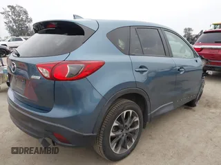 2016 Mazda CX-5 Grand Touring with VIN JM3KE2DY7G0875678, listed as a IAAI auction lot 42104888 with 30,566 mi miles. Bid and sale history available at carsss.com. Image 4.