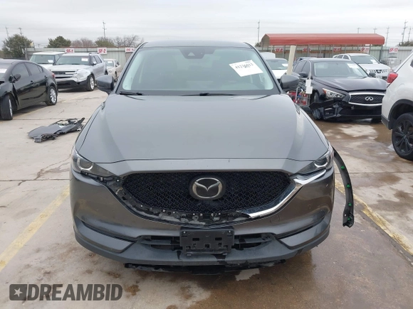 2021 Mazda CX-5 Touring with VIN JM3KFBCM0M0342210, listed as a IAAI auction lot 41236013 with 96,012 mi miles. Bid and sale history available at carsss.com. Image 13.