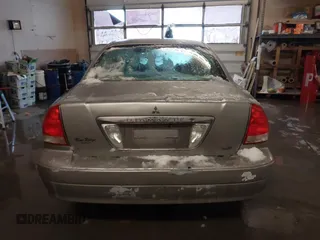 2002 Mitsubishi Diamante LS z VIN 6MMAP67P32T005867, wystawiony jako IAAI lot #41586460 z przebiegiem 390 586 mil mil oraz . Historia ofert i sprzedaży dostępna na DreamBid. Obrazek 16.