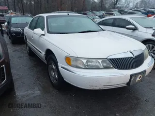 2001 Lincoln Continental with VIN 1LNHM97V51Y670610, listed as a IAAI auction lot 41439804 with 160,114 mi miles. Bid and sale history available at carsss.com. Image 1.