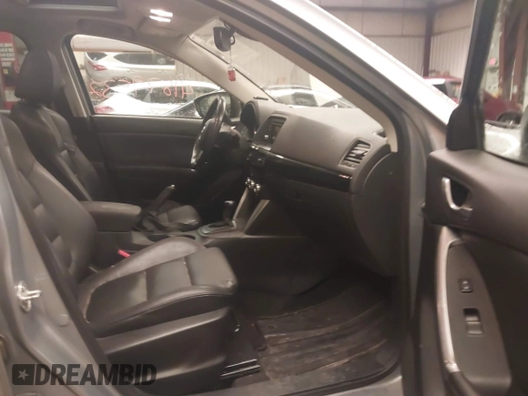 2014 Mazda CX-5 Grand Touring with VIN JM3KE4DY5E0305882, listed as a IAAI auction lot 41879532 with 173,443 mi miles. Bid and sale history available at carsss.com. Image 5.
