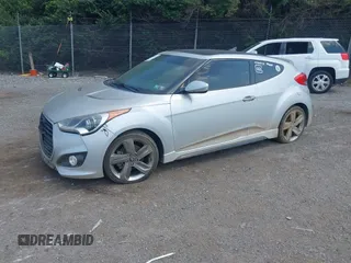 2013 Hyundai Veloster Turbo with VIN KMHTC6AE1DU177023, listed as a IAAI auction lot 42604617 with 102,087 mi miles and . Bid and sale history available at DreamBid. Image 2.
