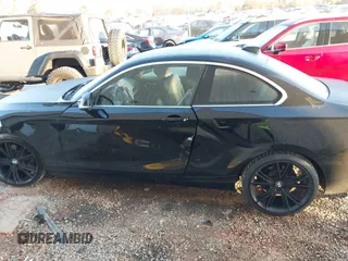 2015 BMW 2 Series 228i with VIN WBA1F5C55FV256604, listed as a IAAI auction lot 41841754 with 118,354 mi miles. Bid and sale history available at carsss.com. Image 14.