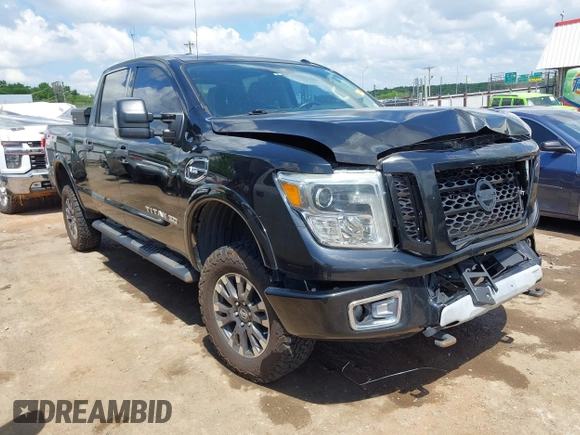2017 Nissan Titan Platinum Reserve z VIN 1N6AA1F43HN500781, wystawiony jako IAAI lot #42220311 z przebiegiem 133 612 mil mil oraz . Historia ofert i sprzedaży dostępna na DreamBid. Obrazek 1.