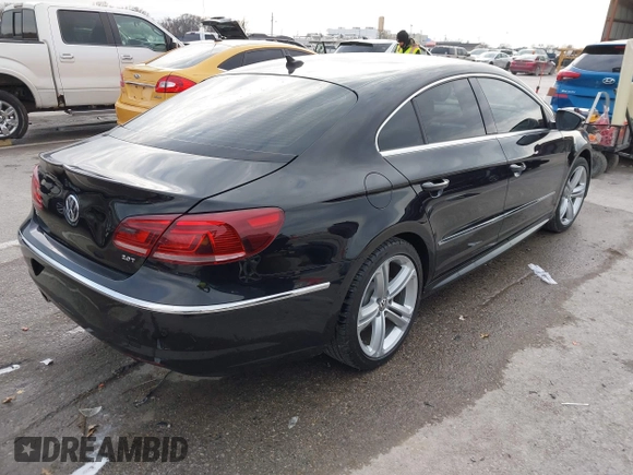 2014 Volkswagen CC R-Line with VIN WVWBN7ANXEE521055, listed as a IAAI auction lot 41197539 with 94,902 mi miles. Bid and sale history available at carsss.com. Image 4.