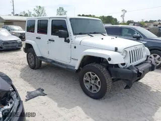 2015 Jeep Wrangler Unlimited Rubicon Hard Rock with VIN 1C4HJWFG7FL684057, listed as a IAAI auction lot 41963885 with 103,240 mi miles. Bid and sale history available at carsss.com. Image 1.
