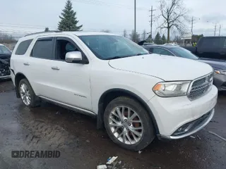 2014 Dodge Durango Citadel with VIN 1C4RDJEG0EC476018, listed as a IAAI auction lot 41212456 with 154,929 mi miles and . Bid and sale history available at DreamBid. Image 1.
