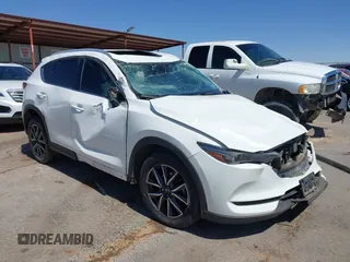 2018 Mazda CX-5 Grand Touring with VIN JM3KFADM9J0402490, listed as a IAAI auction lot 42316624 with Not provided miles and . Bid and sale history available at DreamBid. Image 1.