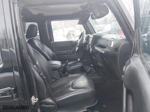 2015 Jeep Wrangler Unlimited Rubicon Hard Rock with VIN 1C4HJWFG9FL569962, listed as a IAAI auction lot 41557801 with 78,597 mi miles. Bid and sale history available at carsss.com. Image 5.