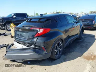 2020 Toyota C-HR LE with VIN JTNKHMBX9L1063563, listed as a IAAI auction lot 41986457 with 143,694 mi miles. Bid and sale history available at carsss.com. Image 4.