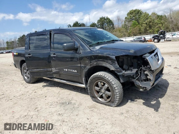 2015 Nissan Titan Pro-4X with VIN 1N6BA0EC1FN507491, listed as a Copart auction lot 51240915 with 165,510 mi miles and Salvage title. Bid and sale history available at DreamBid. Image 4.